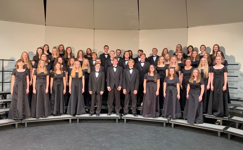 group photos of choir students on risers in black outfits smiling